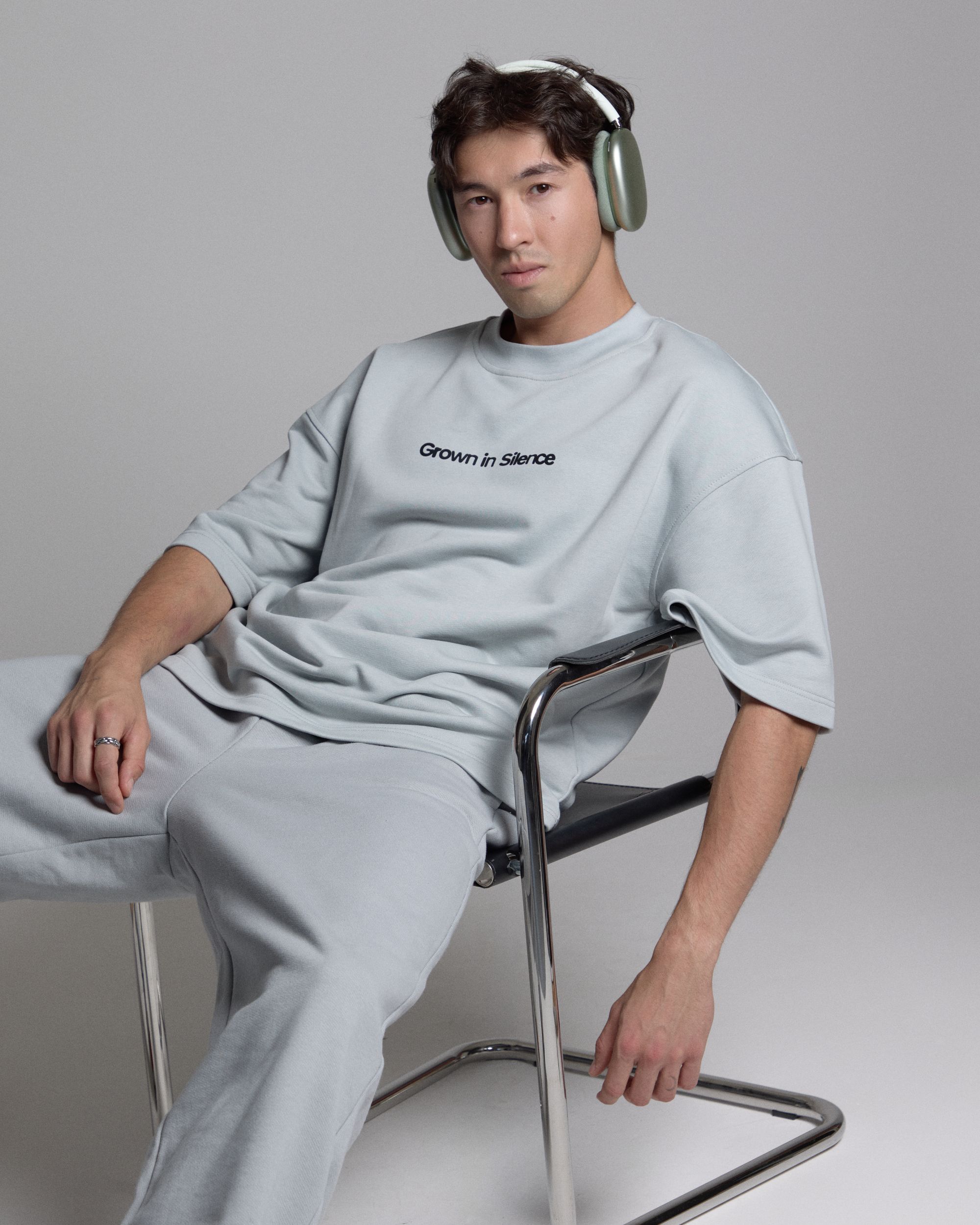 Grown In Silence hero, man in Cloud Metallic hoodie and joggers