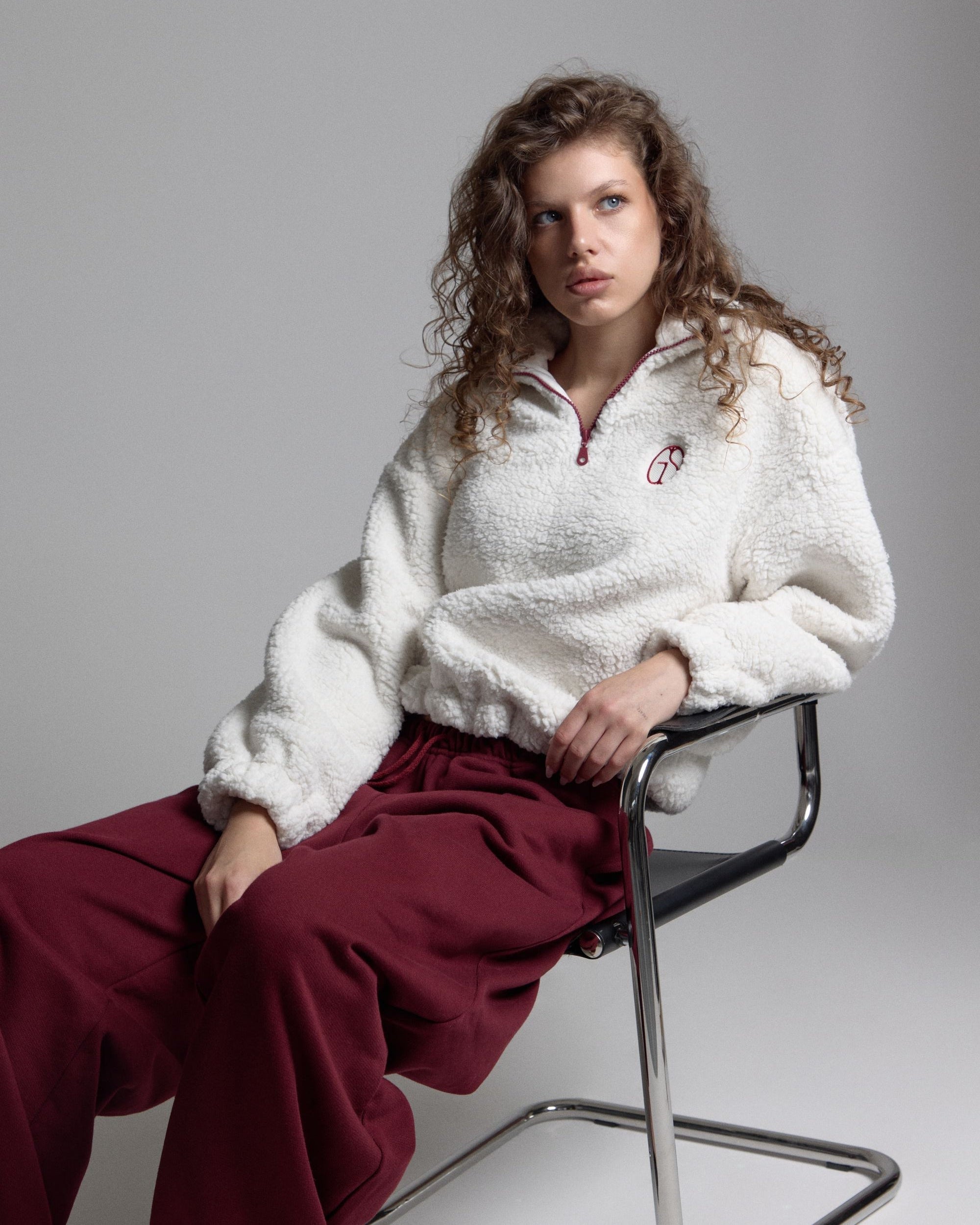 Grown In Silence hero, woman in Cloud Dancer anorak
