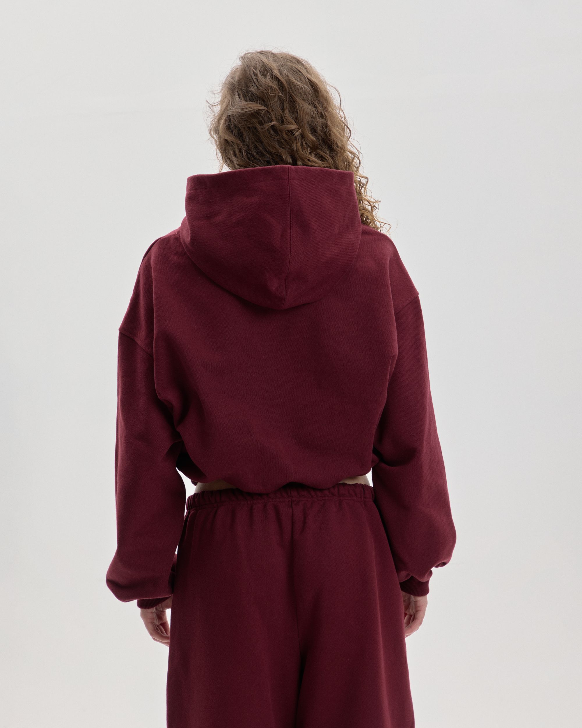 Grown In Silence cropped mini hoodie in Ruby Wine, back view close-up with hood