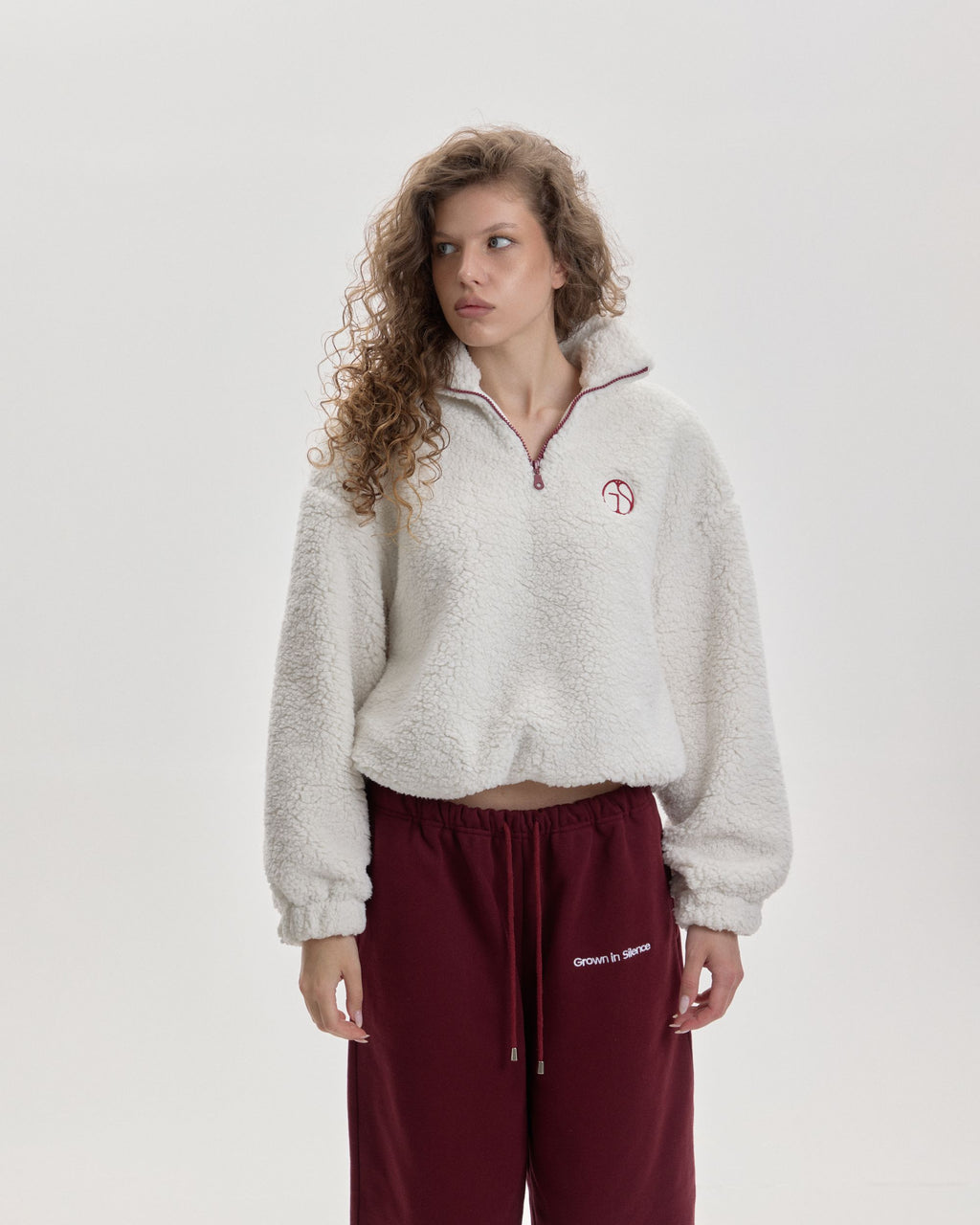 Grown In Silence oversized quarter-zip anorak in Cloud Dancer, styled with burgundy joggers
